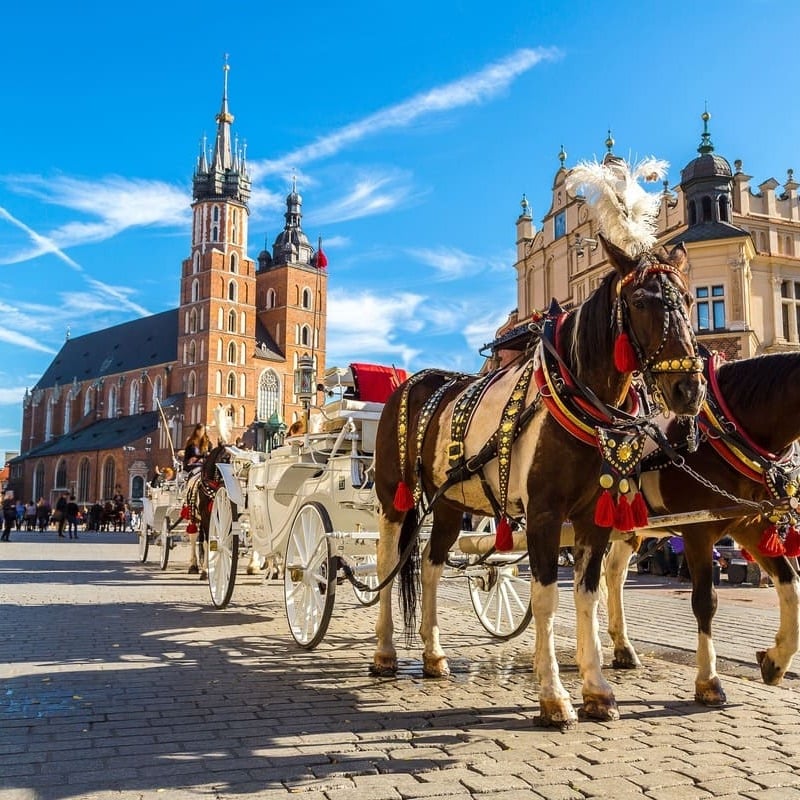 A Traditional Horse Carriage In The Central Square In Krakow, Poland, Eastern Europe