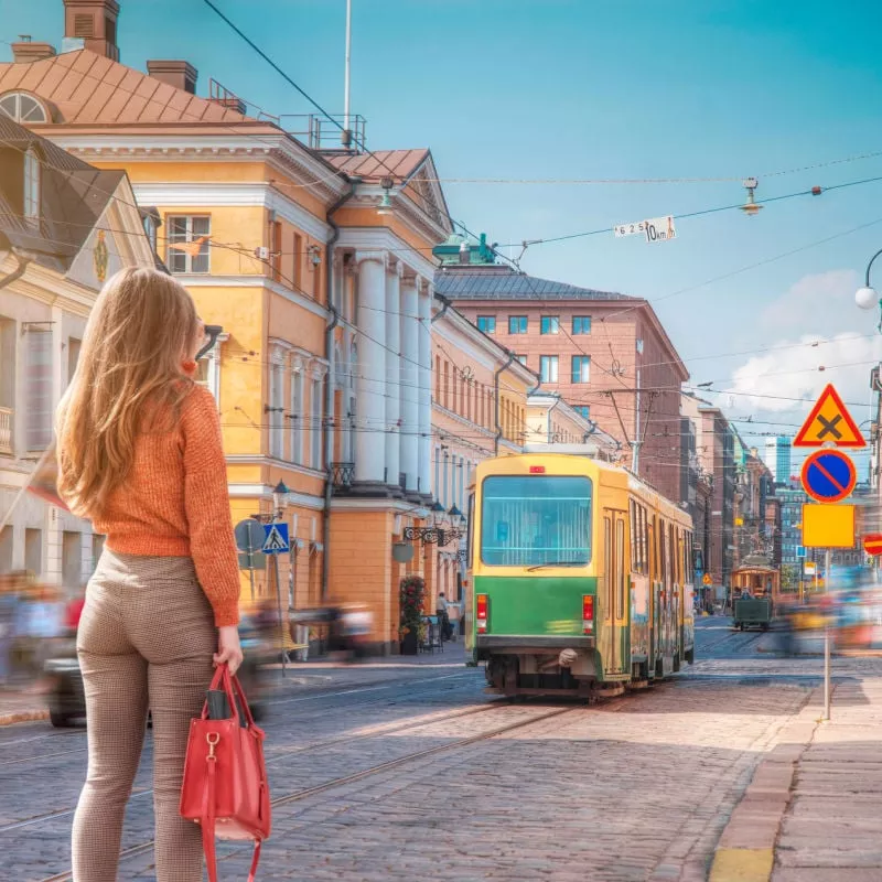 A woman walks through the center of Helsinki. Finland. copy