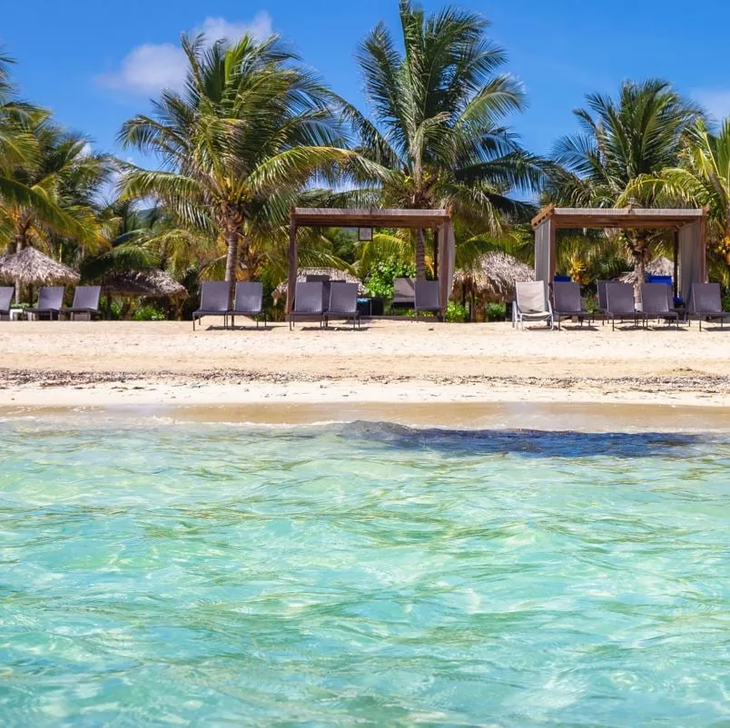 Beach and ocean with cabanas on the sand montego bay jamaica