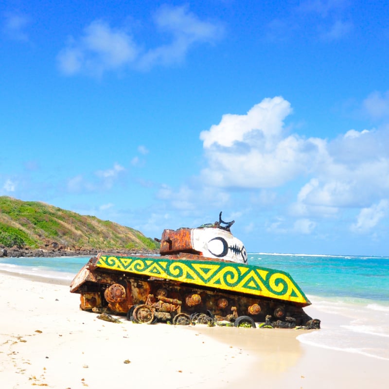 Colorful tank sitting on a white sand beach at Flamenco Beach in Culebra Puerto Rico