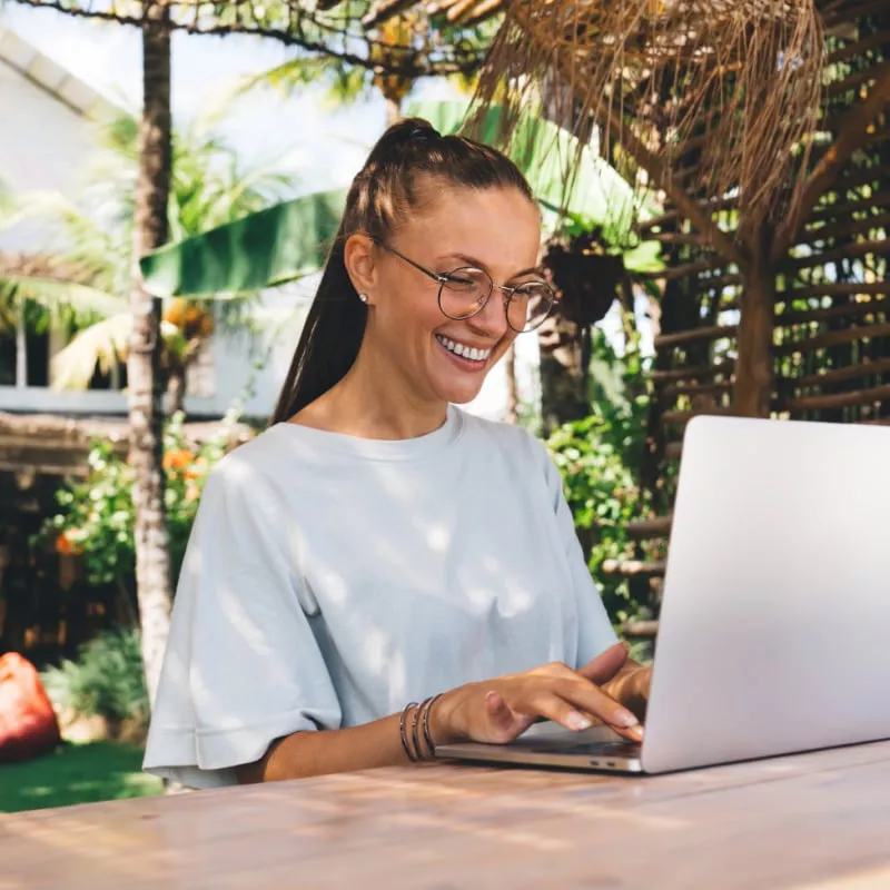 Digital Nomad Working Outside In A Green Environment, Unspecified Location