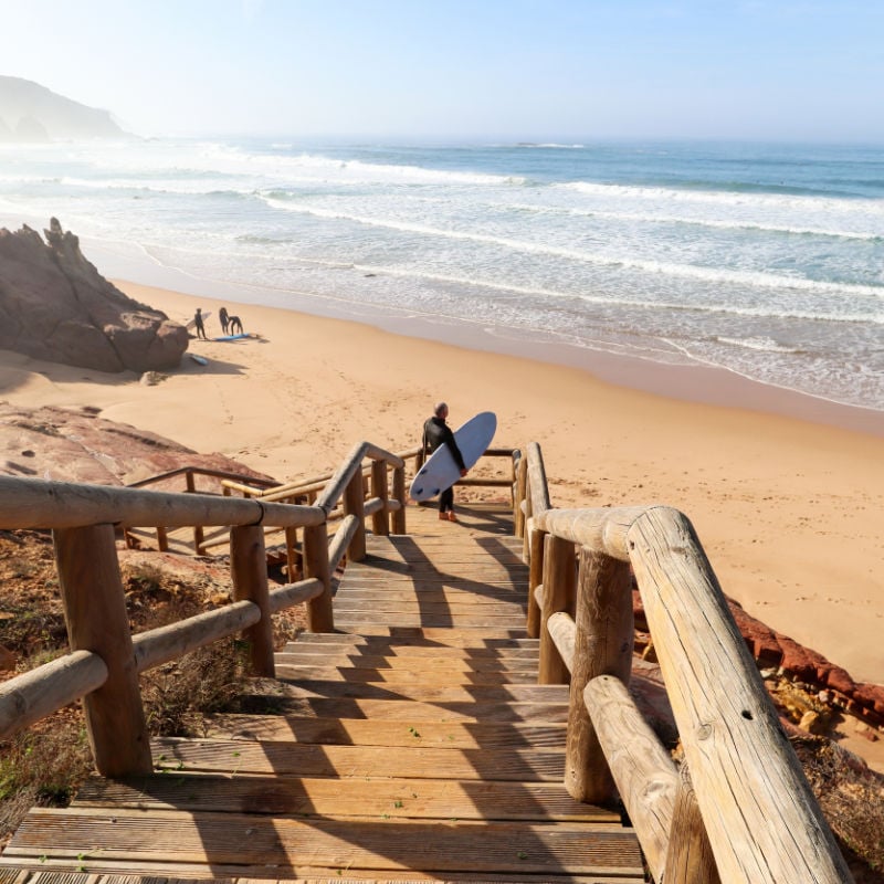 Surfer in Praia Do Amado, Algarve, Portugal