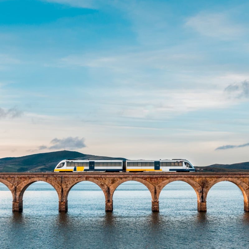 Train over Ebro reservoir Spain