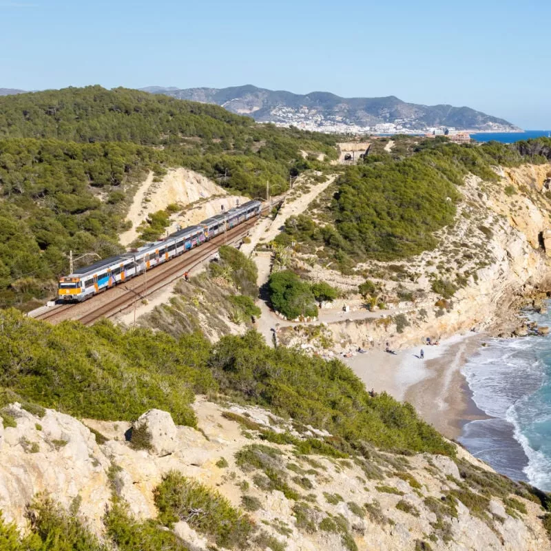 Train traveling along the coast in Spain