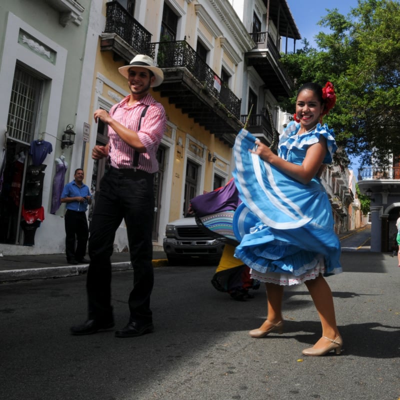 man and woman dancing in street puerto rico