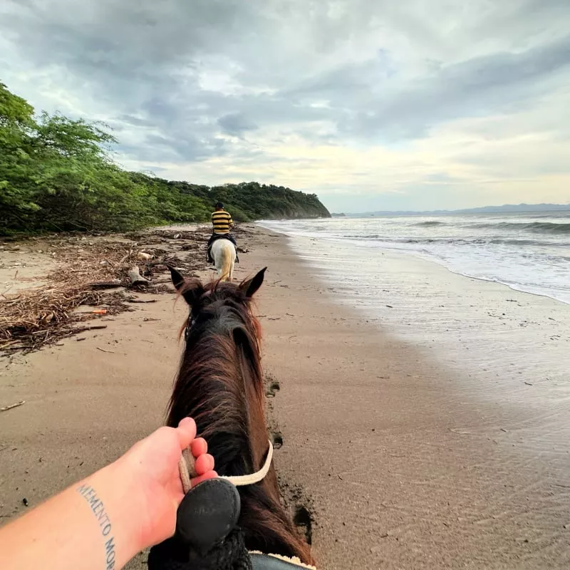 Riding a horse on a beach in Nicaragua