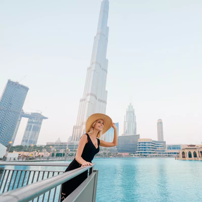 A Female Tourist In Dubai With The Burj Khalifa For Background, United Arab Emirates