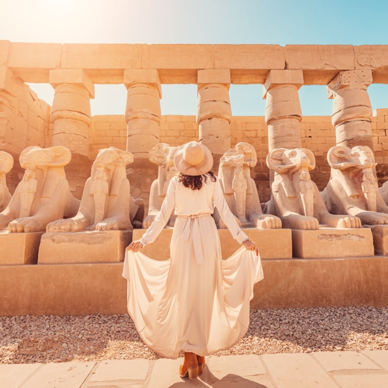 Woman in Egypt looking at old ruins