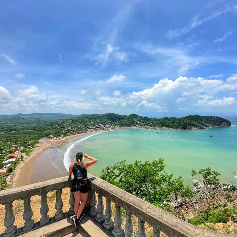 Woman looking out over San Juan del Sur beach town in Nicaragua