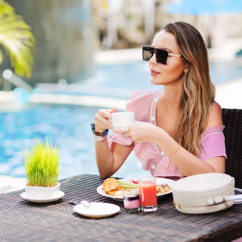 woman relaxing at a resort, unspecified location