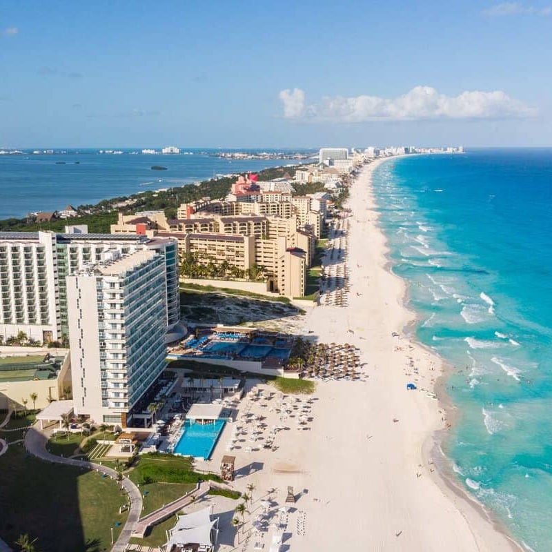 Aerial View Of The Hotel Zone In Cancun, Bounded By The Bright Blue Waters Of The Caribbean Sea, On The Mayan Coast Of Mexico, Quintana Roo