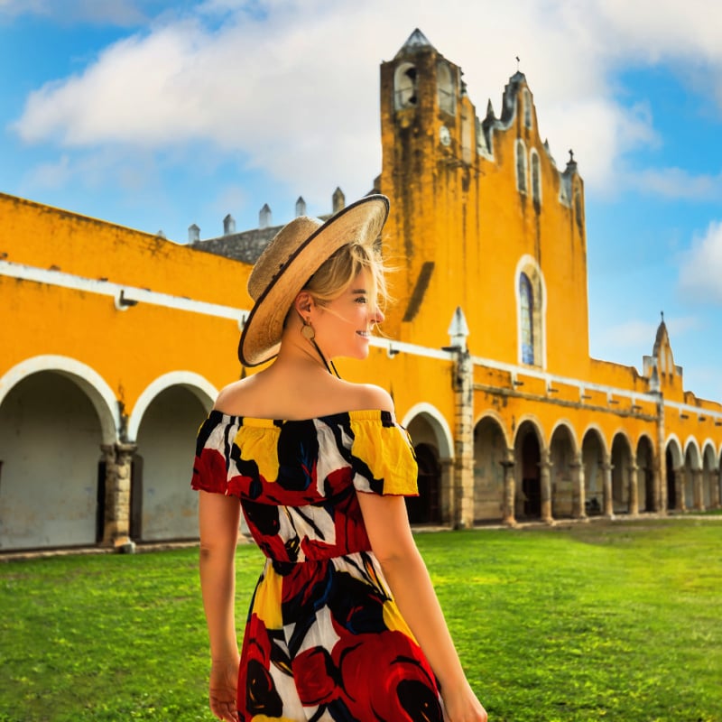 Woman in front of building in Izamal, Mexico