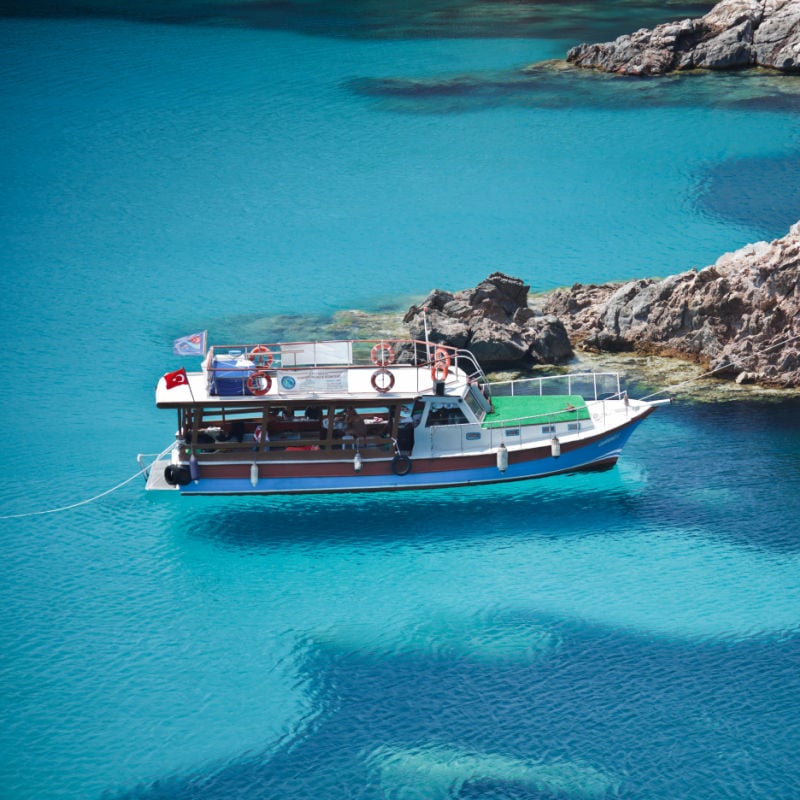 boat in blue waters of bozcaada