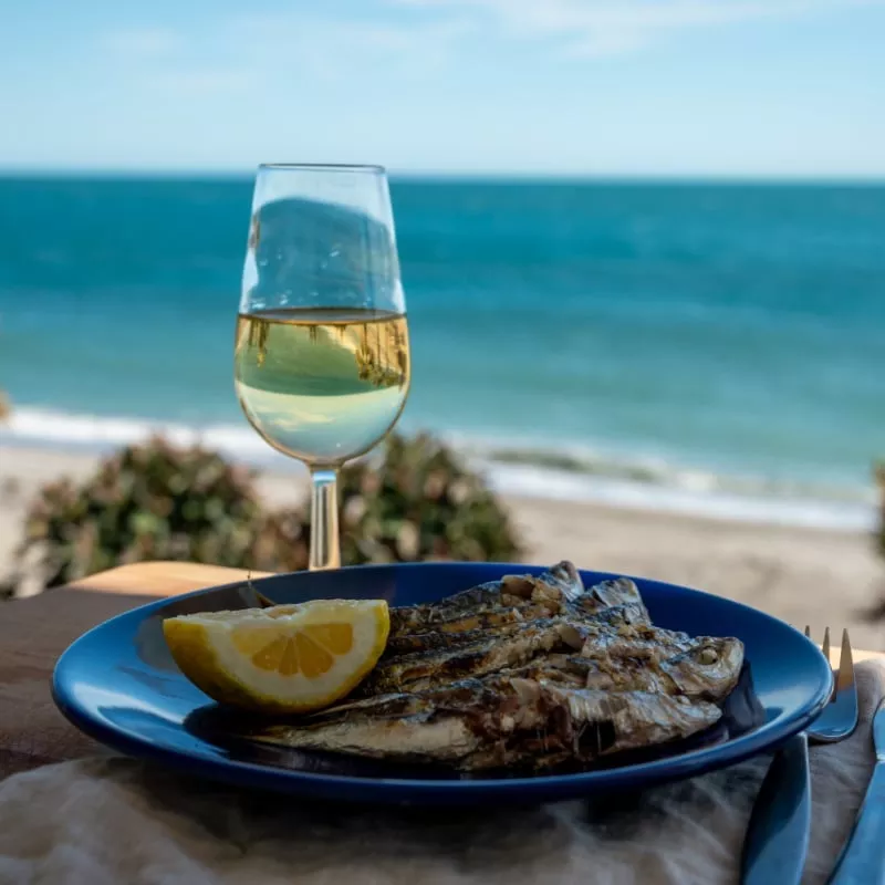 seafood and wine on a table in Malaga, Spain