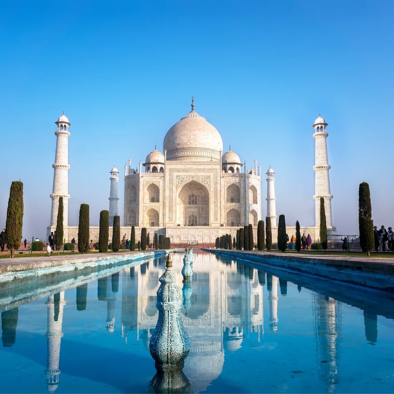 view of Taj Mahal monument reflecting in water of the pool, Agra, India