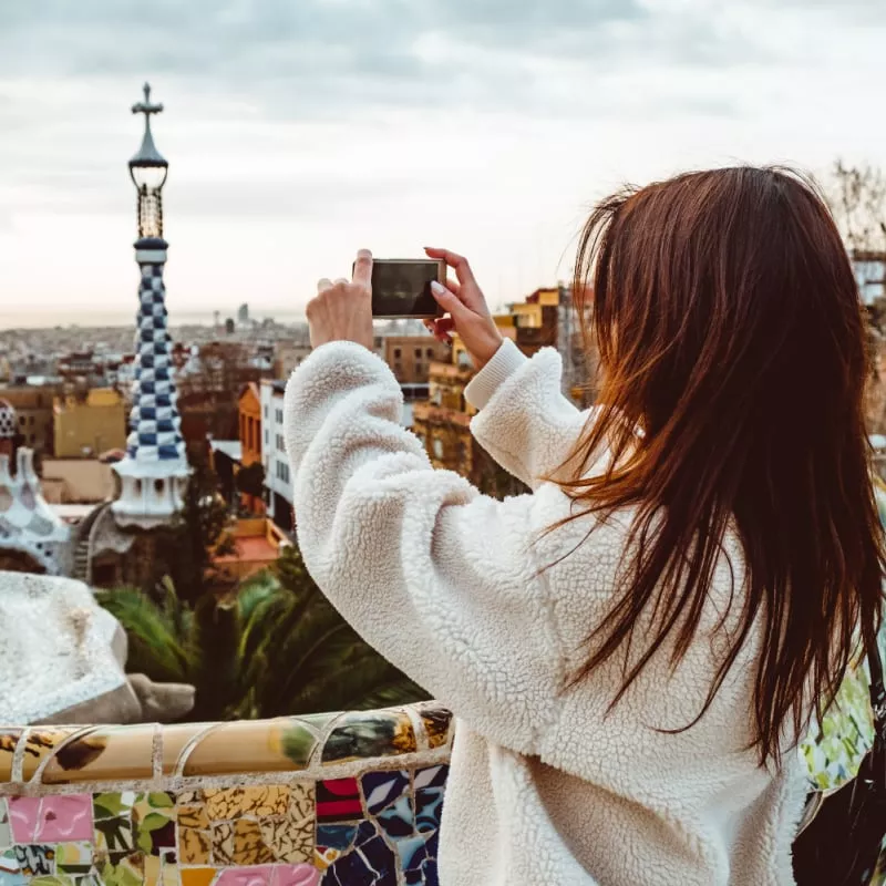 woman taking a picture of Barcelona skyline, Spain