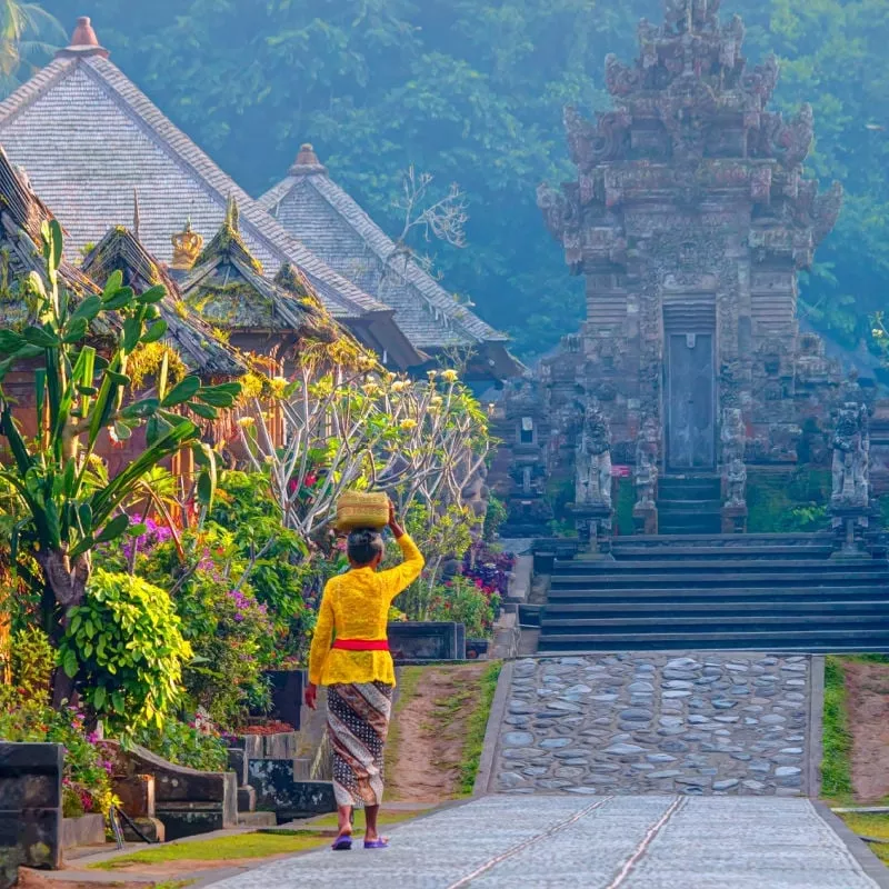 Woman Walking In A Village In Bali, Indonesia, Southeast Asia