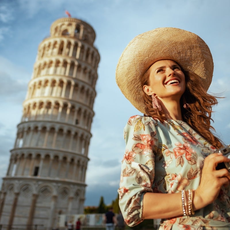 Smiling Young Solo Female Traveler Photographer In Pisa, Italy, Southern Europe