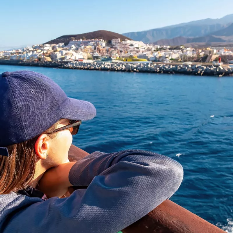 Woman enjoying the panoramic view from the ferry Canary Islands