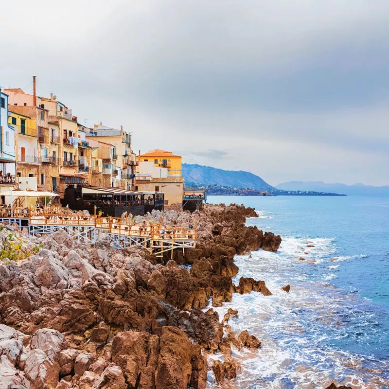 colorful houses and beach in cefalu palermo sicily italy