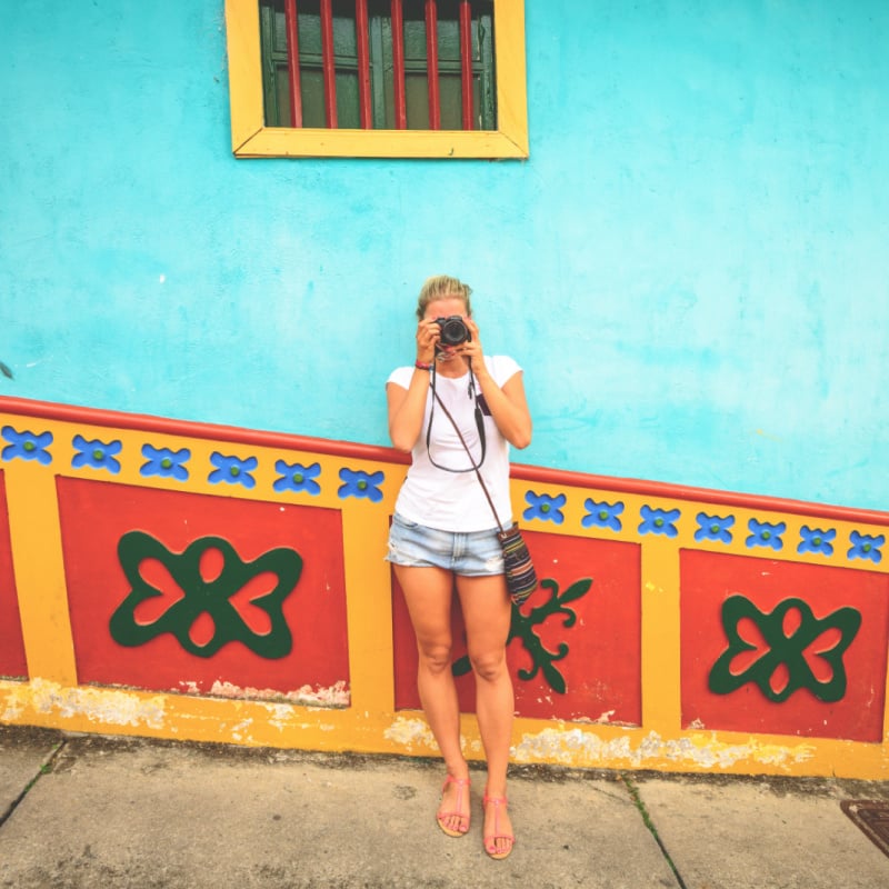 woman tourist with camera in guatape colombia