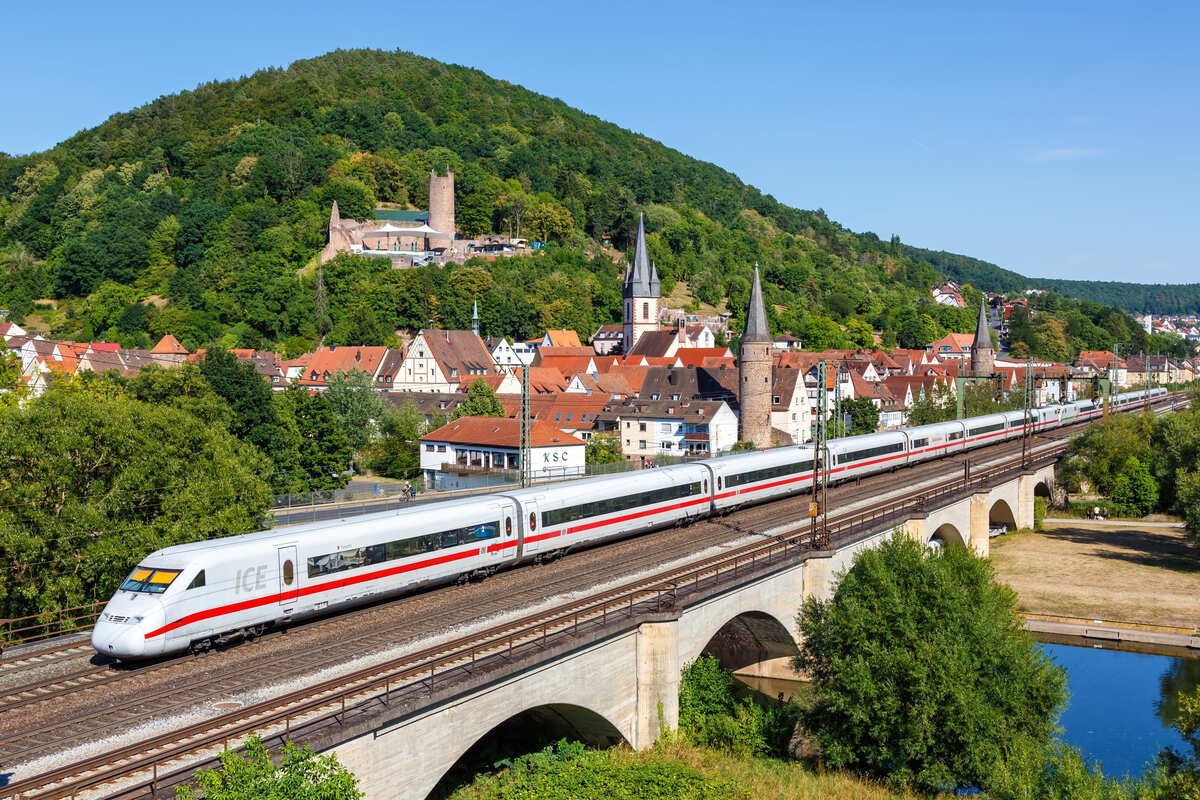 A Train Traveling Past The Small Historical Town Of Gemuenden am Main, Germany, Europe