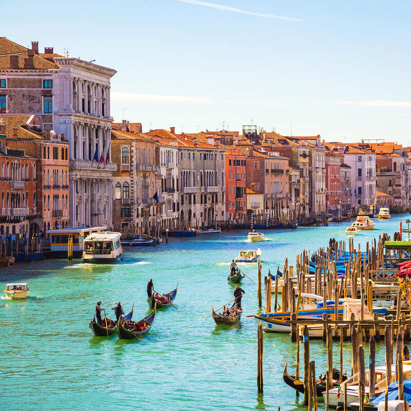 Gondolas Traveling Through The Canals Of Venice, Italy