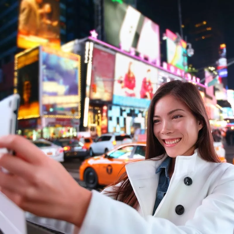 Happy,Woman,Tourist,Taking,Photo,Picture,With,Tablet,In,New