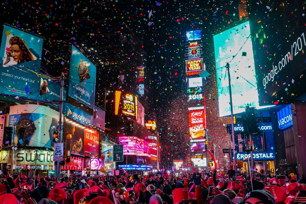 New York City, USA, Atmospheric new year's eve celebration on famous times square intersection after midnight with countless happy people enjoying the party