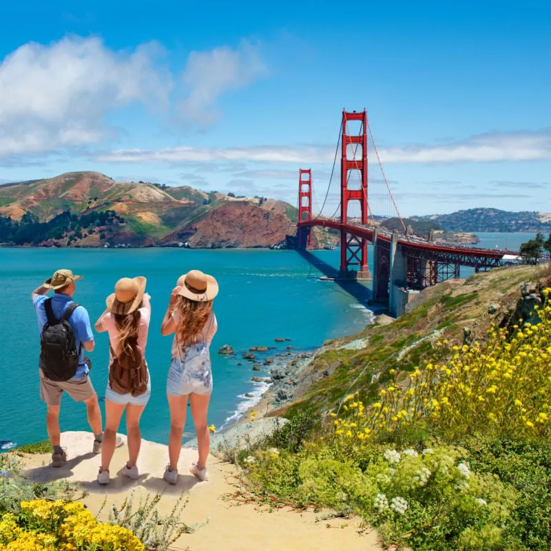 family viewing the golden gate bridge on a sunny day