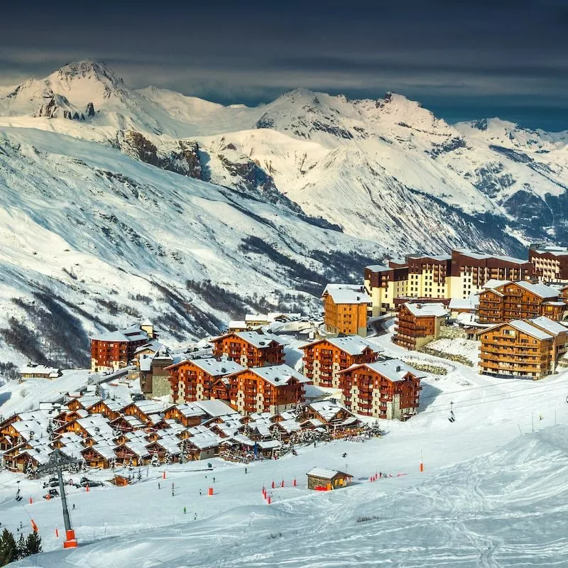 Amazing winter landscape and ski resort with typical alpine wooden houses in French Alps, Les Menuires, 3 Vallees, France, Europe