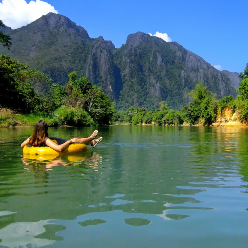 tourist river tubing on the nam song in vang vieng laos