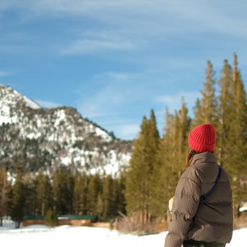 woman hiking in snowy mountains