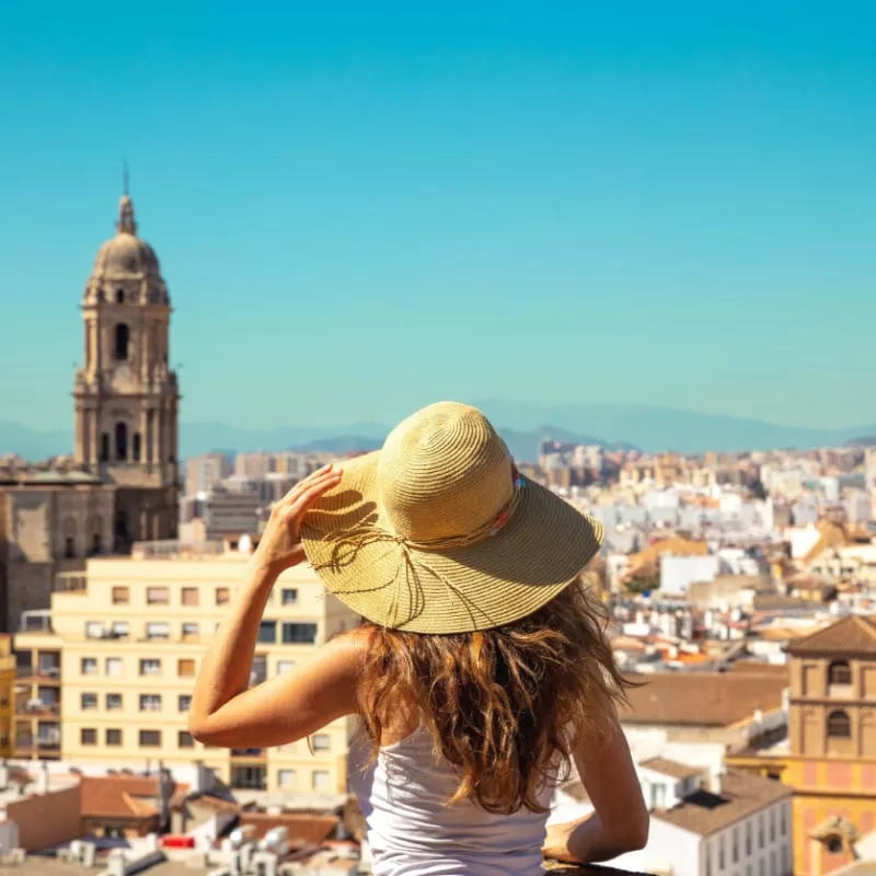 woman looking at panoramic view of malaga spain