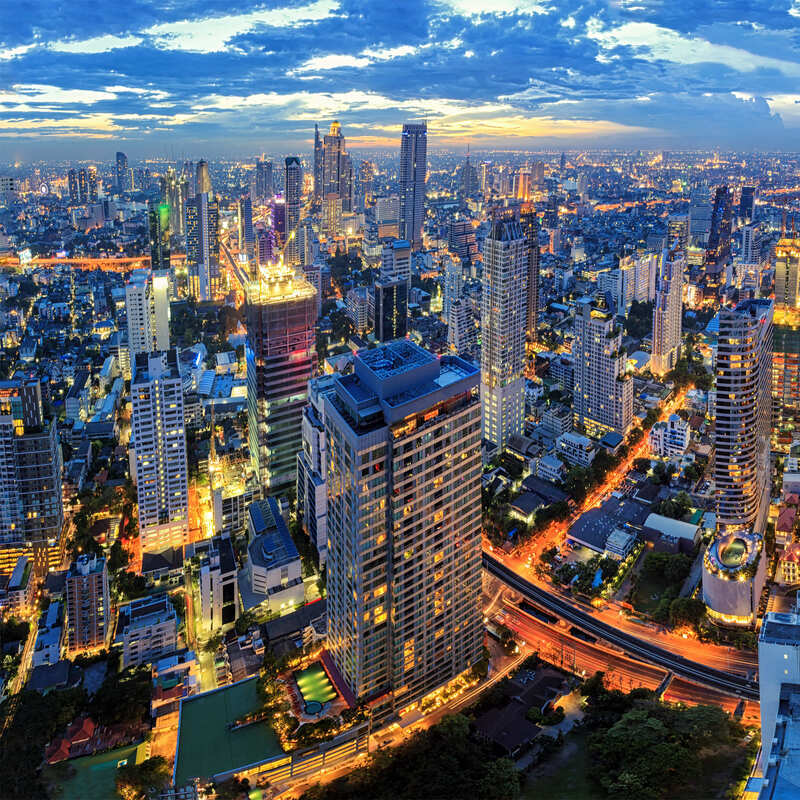 Aerial View Of Modern Skyscrapers At Night In Bangkok, Thailand, Southeast Asia