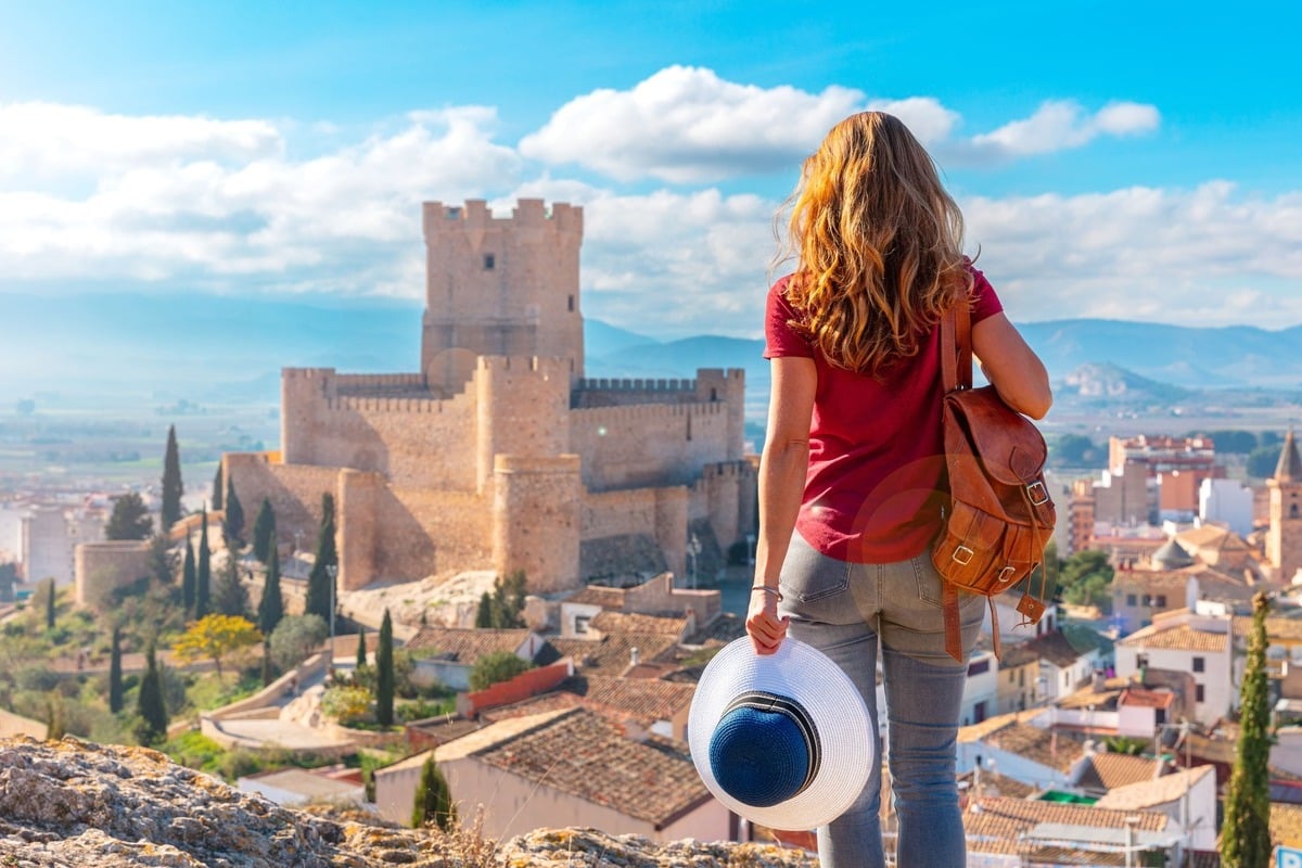 Female Tourist Admiring A View Of Villena, Andalusia, Spain, Southern Europe