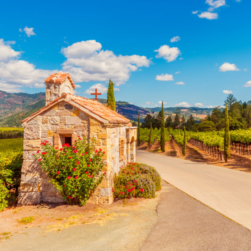 an old chapel next to vineyards in napa valley california