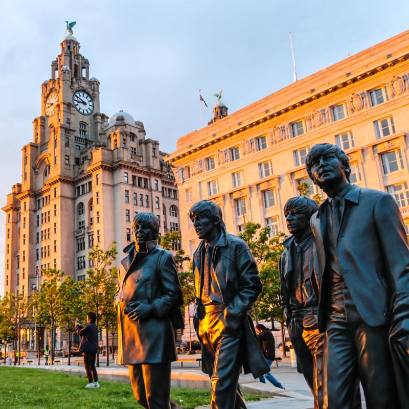 These Are 6 Of The Most Amazing Destinations To Visit In The U K For   Beatles Statues Outside Of The Liver Building In Liverpool England 