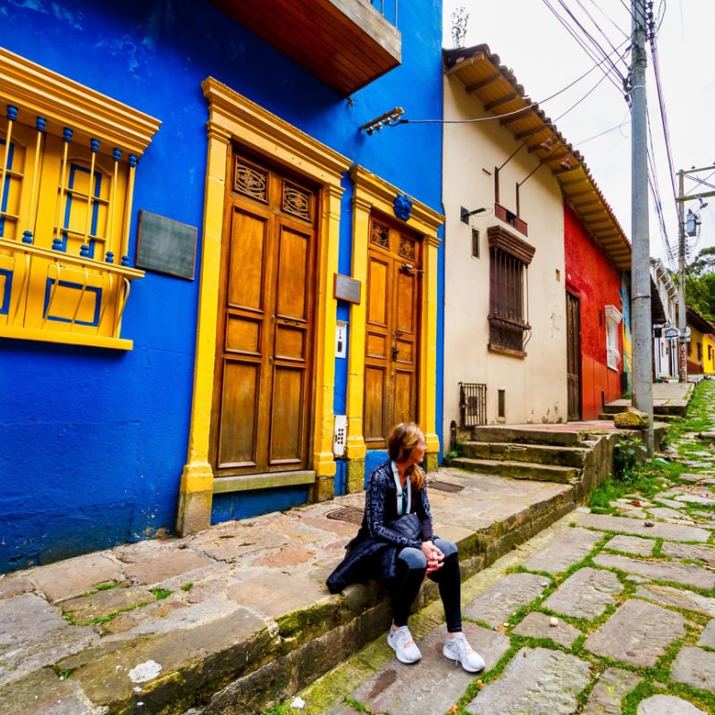 Female Tourist Pictured In Cobbled Street In Colombia, South America