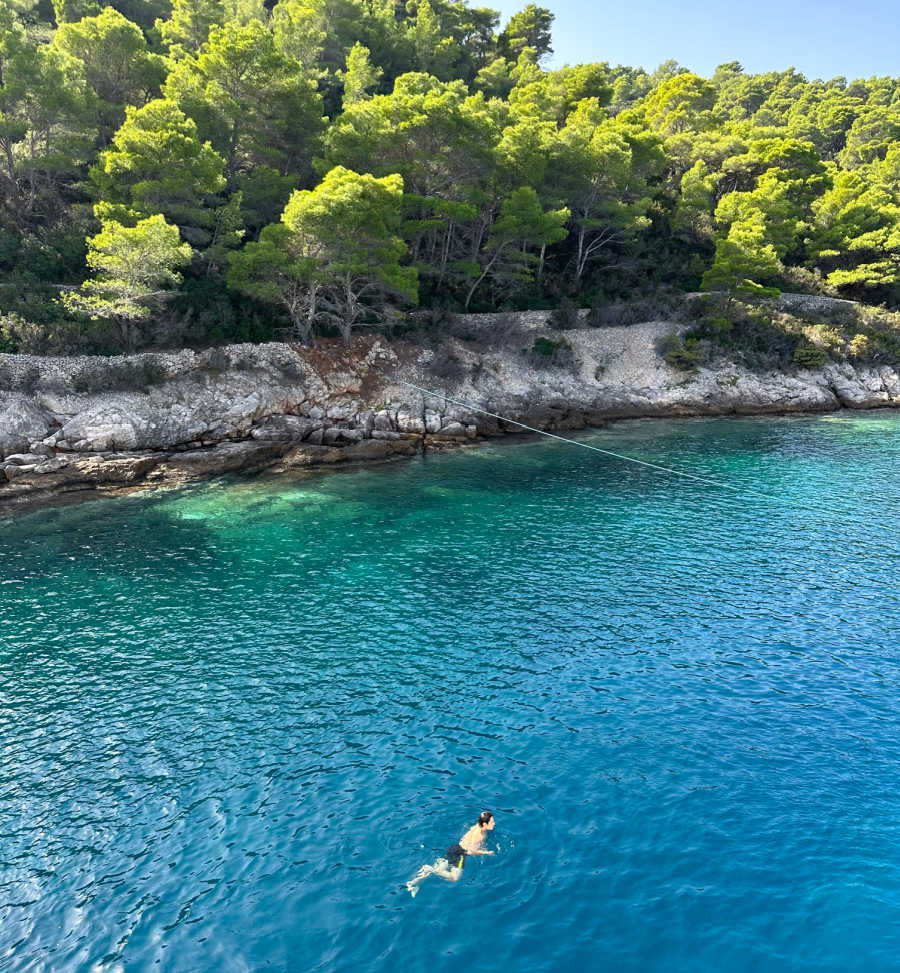 man in the ocean in croatia