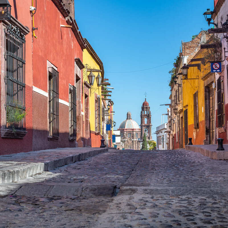 Colonial Street Lined By Colorful Buildings In San Miguel de Allende, Mexico, Latin America