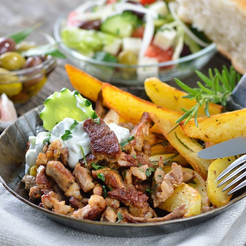 Greek souvlaki with tzatziki and fried potatoes