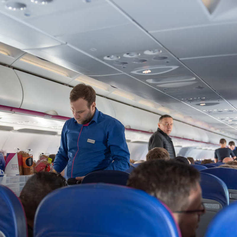 Wizz Air Staff Pictured Mid Flight, Unspecified Flight, Europe