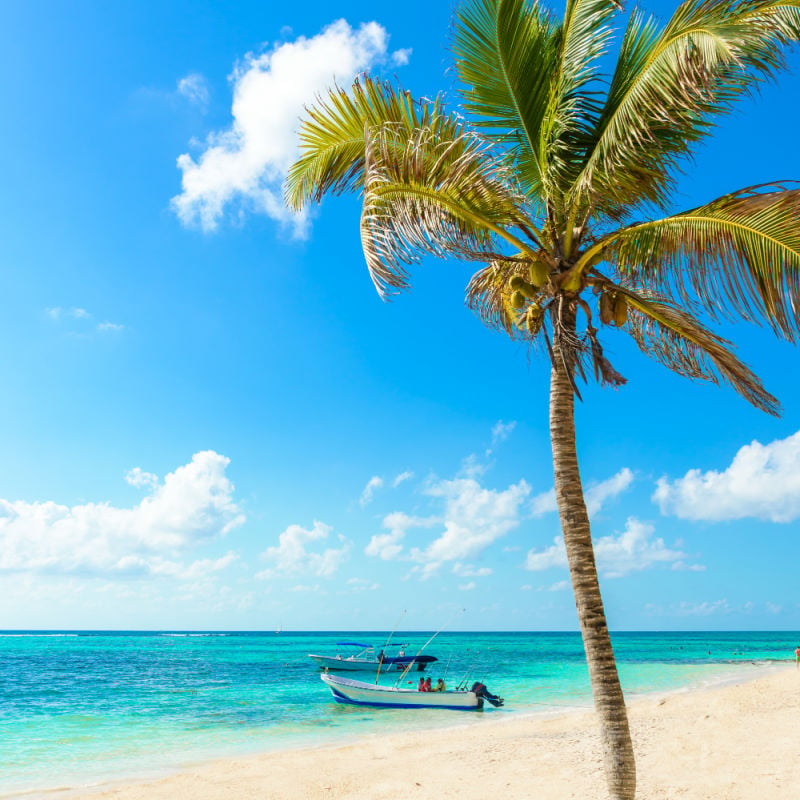 boat on a beach in akumal