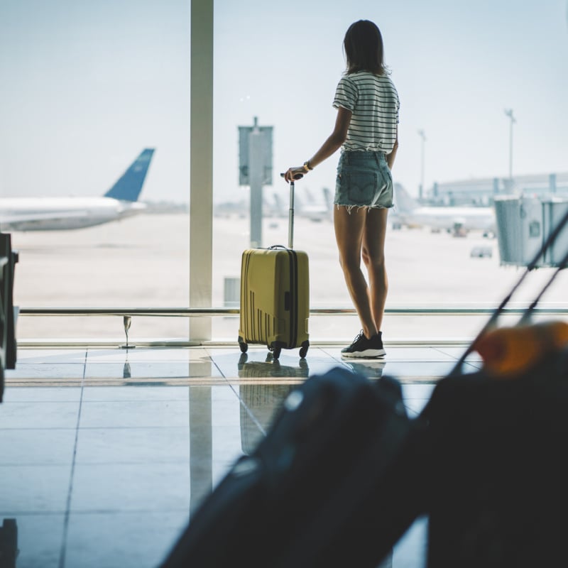 view of a young woman on an airport