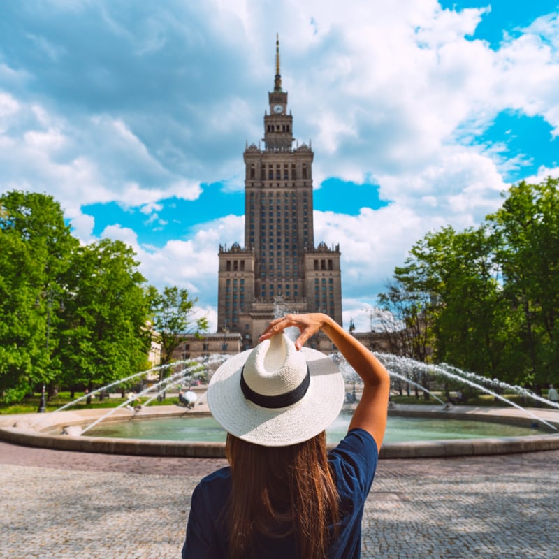 woman looks at palace of culture and science in warsaw poland