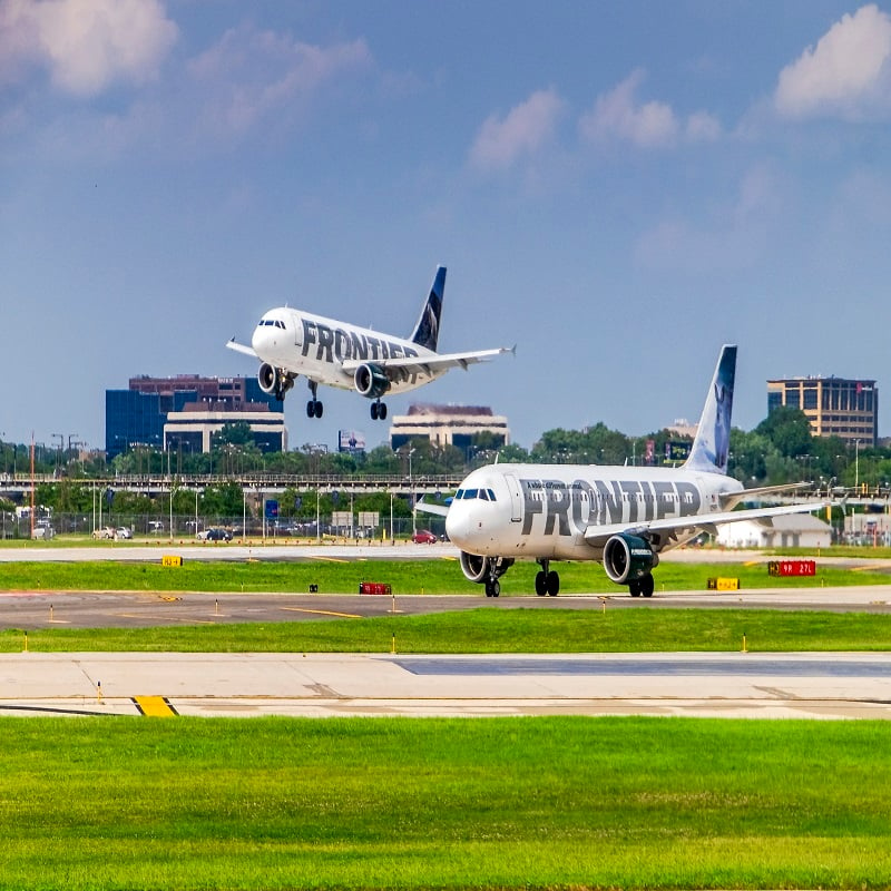 Frontier planes landing on a hot summer day in July