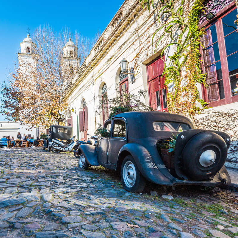 Old Car Parked In A Cobblestone Street In Colonia Del Sacramento, Colonia Department, Uruguay, South America