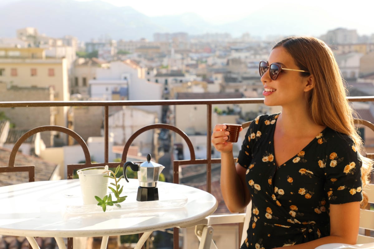 Woman Drinking Coffee in Italy