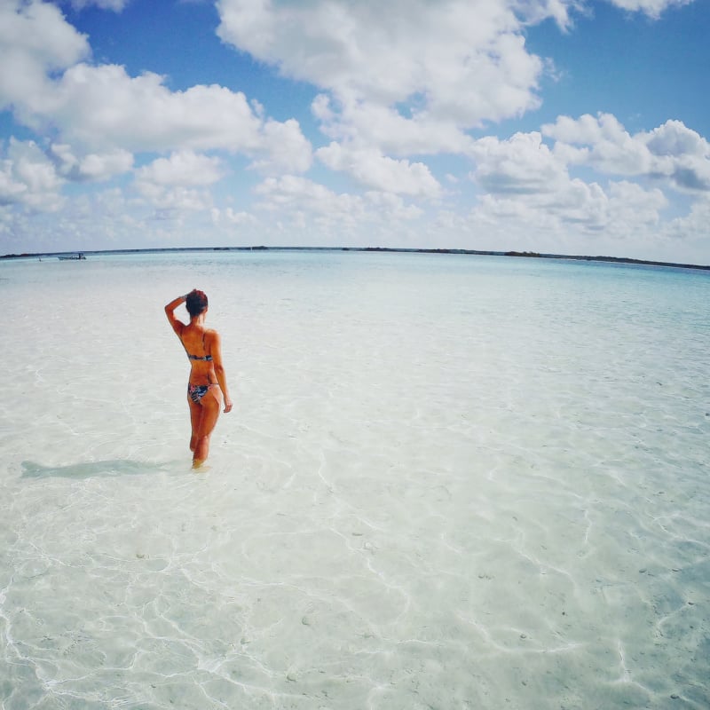 Tourist in clear water of Bacalar